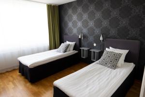 Postel nebo postele na pokoji v ubytování City Central Hotel Örebro by First Hotels