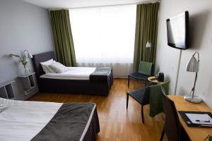 Postel nebo postele na pokoji v ubytování City Central Hotel Örebro by First Hotels