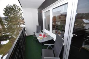 an apartment balcony with a desk and a window at Ferienwohnung-in-Prien in Prien am Chiemsee
