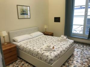Posteľ alebo postele v izbe v ubytovaní Nunziata Apartment