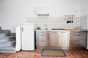 Una cocina o kitchenette en Arromaniu