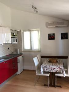 Kuchyň nebo kuchyňský kout v ubytování Residence4a-Appartamento Rosso