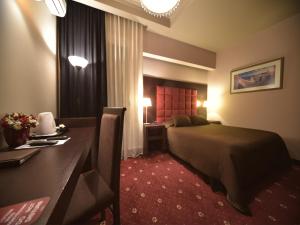 Postel nebo postele na pokoji v ubytování Hotel Doro City