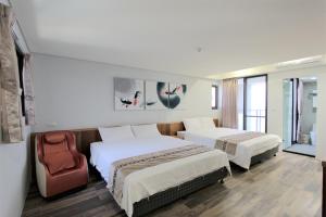 Postel nebo postele na pokoji v ubytování Apause Hotel