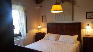 Postel nebo postele na pokoji v ubytování Casa Vacanze Fornace + 24 fotografií