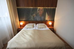 Posteľ alebo postele v izbe v ubytovaní Hotel Vabank