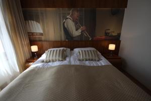 Posteľ alebo postele v izbe v ubytovaní Hotel Vabank