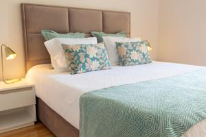 Cama ou camas em um quarto em Graça Apartment