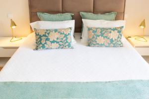 Cama ou camas em um quarto em Graça Apartment
