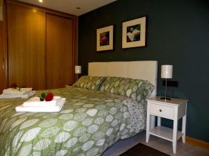 A bed or beds in a room at Les Cotolles Centro