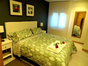 A bed or beds in a room at Les Cotolles Centro