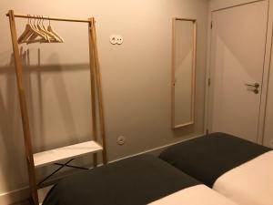 A bed or beds in a room at Welcome inn Viseu