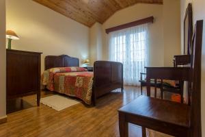 Cama ou camas em um quarto em Apartamentos em Casa da Avó Inês