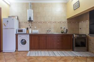 A cozinha ou cozinha compacta de Apartamentos em Casa da Avó Inês
