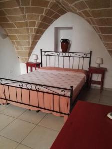 En eller flere senge i et værelse på Le Perle dello Jonio