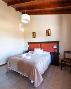 Posteľ alebo postele v izbe v ubytovaní Patagonia Suites
