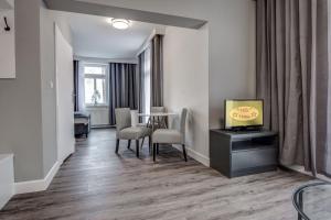 Televízia a/alebo spoločenská miestnosť v ubytovaní Villa Venus