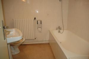 a bathroom with a sink and a tub and a toilet at Hotel du Luxembourg in Balsièges +45 photos
