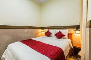 Ein Bett oder Betten in einem Zimmer der Unterkunft Ogix Cliff Paradise