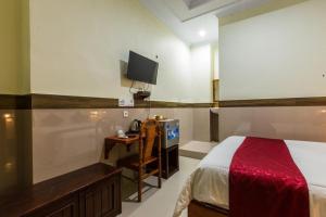 Ein Bett oder Betten in einem Zimmer der Unterkunft Ogix Cliff Paradise