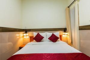 Ein Bett oder Betten in einem Zimmer der Unterkunft Ogix Cliff Paradise