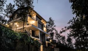 a white building with lights on the side of it at Falcon Crest in Vagamon