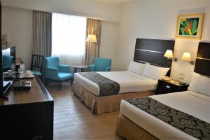 Postel nebo postele na pokoji v ubytování Days Hotel by Wyndham Iloilo