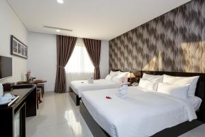 Postelja oz. postelje v sobi nastanitve Dylan Hotel Danang