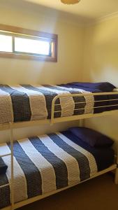 Postel nebo postele na pokoji v ubytování Parndana Hotel Cabins