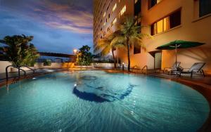 a large swimming pool in front of a building at Sunway Hotel Georgetown Penang in George Town