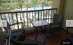 A balcony or terrace at Amazing view apartment in Golf Porto Marina with marina access