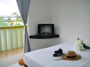 Televisyen dan/atau pusat hiburan di Harmony Bed & Bakery