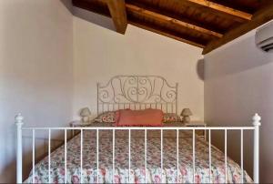 Letto o letti in una camera di Borgo degli Aranci