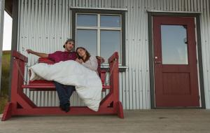 a man and a woman laying on a bunk bed at Norður-Vík in Vík