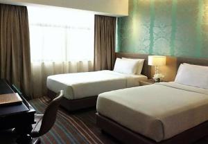 Cosmo Hotel Kuala Lumpur 객실 침대