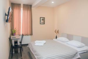 Postel nebo postele na pokoji v ubytování Red Hotel