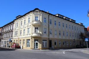 a large white building on the corner of a street at Dream Team Pomorska in Bydgoszcz