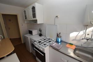 a kitchen with a stove top oven next to a sink at Stuttgart Bad Cannstatt in Stuttgart