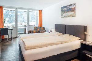 Postel nebo postele na pokoji v ubytování Hotel Restaurant La Furca