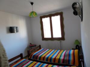 Lova arba lovos apgyvendinimo įstaigoje Maison d' hôtes Tranquyl