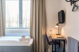 Letto o letti in una camera di Copenhagen Go Hotel