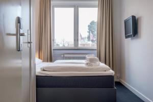 Letto o letti in una camera di Copenhagen Go Hotel