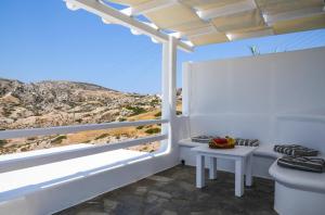 a white room with a view of a mountain at Agia Kyriaki Studios in Agia Kiriaki Beach