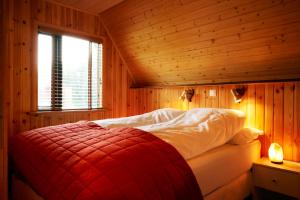 Tempat tidur dalam kamar di Birkihof Lodge