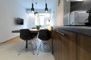 A kitchen or kitchenette at TONIS Le Petit Nicolas 1BD Apartment in Koukaki!