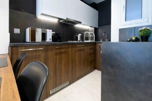 A kitchen or kitchenette at TONIS Le Petit Nicolas 1BD Apartment in Koukaki!