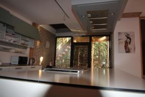 a kitchen with a counter top in front of a window at Champêtre Park View Apartments in Rīga