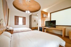 A television and/or entertainment centre at ChunYang Homestay春陽一品居