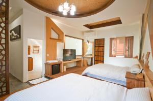 A bed or beds in a room at ChunYang Homestay春陽一品居
