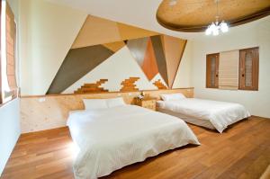 A bed or beds in a room at ChunYang Homestay春陽一品居